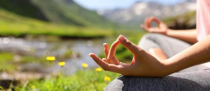 person relaxing in yoga pose