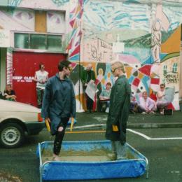 Johanna Sanders and Val Smith in a mud-wrestling anti-bypass performance, 1994.