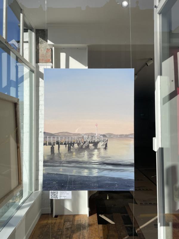 Nightscapes 2: Seatoun wharf, a painting by Brian Nelson in the window of Thistle Hall Gallery