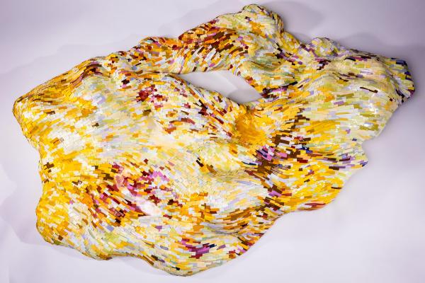 A piece by Erin Jaeger-Freeborn, made from thousands of hand-cut pieces of paper roll together into a multi-coloured abstract form